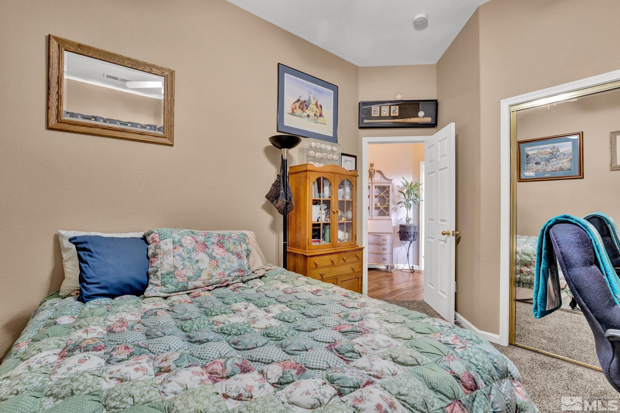 1789 Colavita Way Reno, NV 89521 - Photo 23 of 39 a bedroom with a bed and furniture