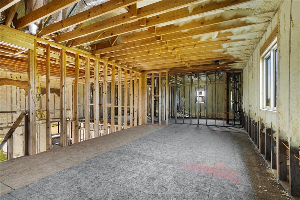 2463 County Road Bonham, TX 75418 - Photo 19 of 29 a view of an empty room with wooden walls