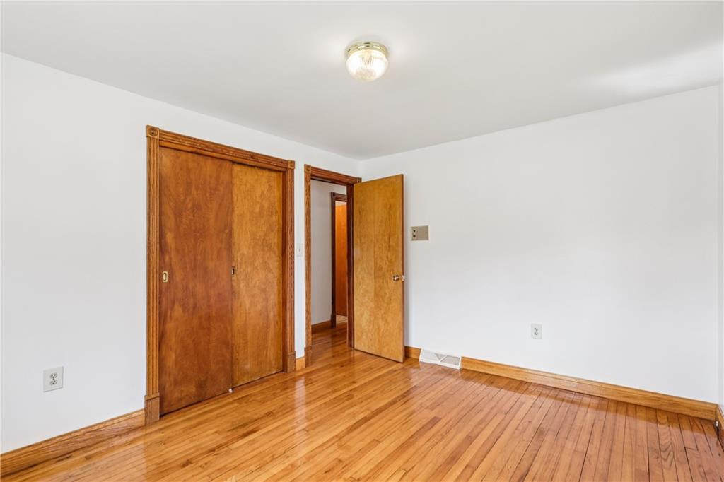 2043 Chicora Road Chicora, PA 16025 - Photo 23 of 50 an empty room with wooden floor and closet