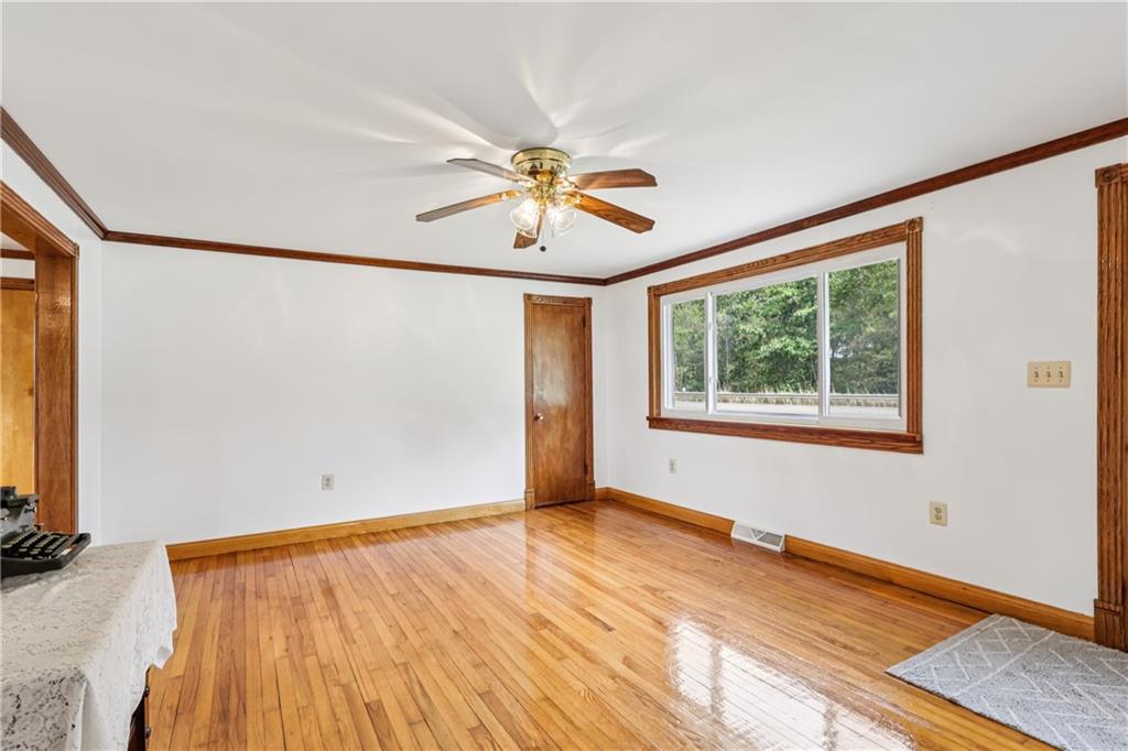 2043 Chicora Road Chicora, PA 16025 - Photo 5 of 50 a view of a room with a window and wooden floor