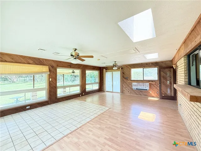 a building outdoor space with patio lots of water fountain in front of it