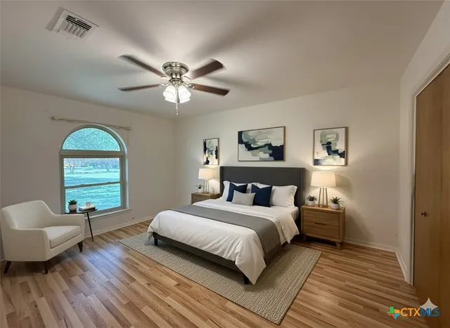 a view of a wooden door and a tree