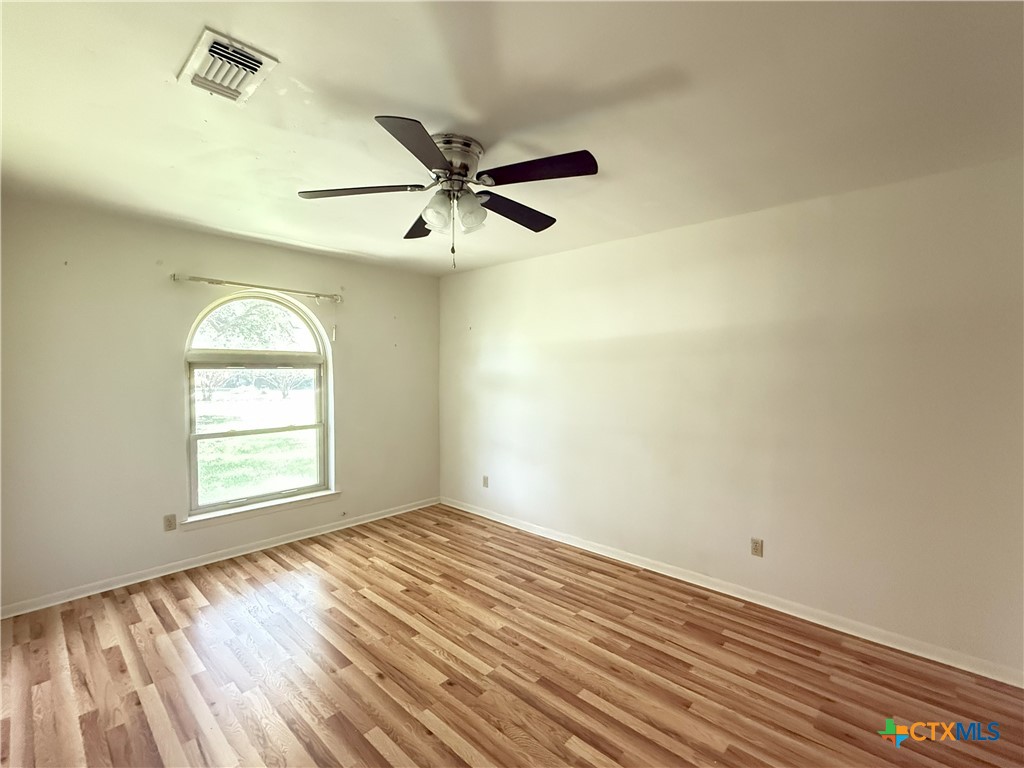 659 County Road 4744 Kempner, TX 76539 - Photo 27 of 48 a view of empty room with wooden floor and fan