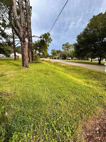 a view of swimming pool with an outdoor space and seating area