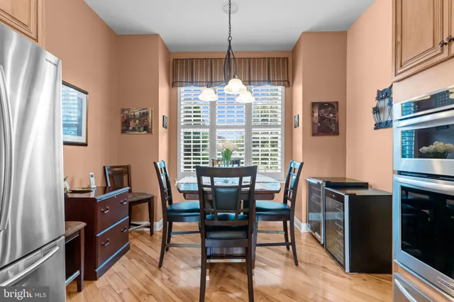 a view of a dining room with furniture and a chandelier
