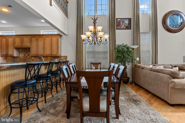 a view of a dining room with furniture and a potted plant