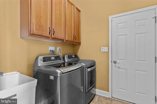 a bathroom with a granite countertop toilet a sink and shower