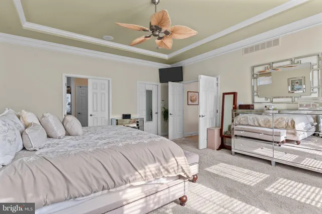 a bathroom with a granite countertop double vanity sink and mirror