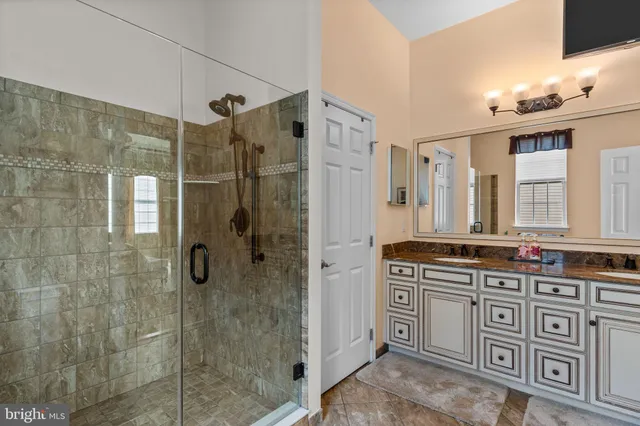 a view of walk in closet with clothes