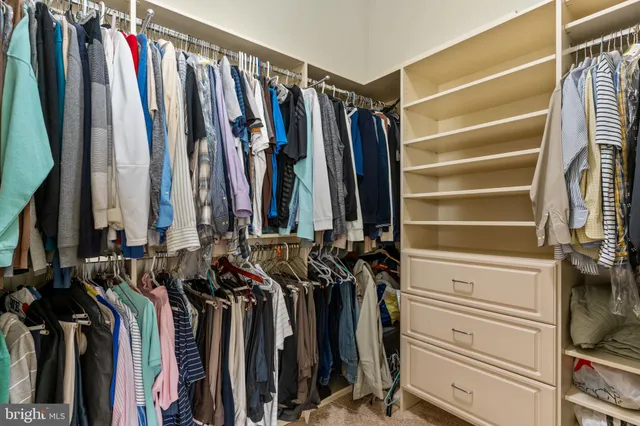 a view of a living room and kitchen