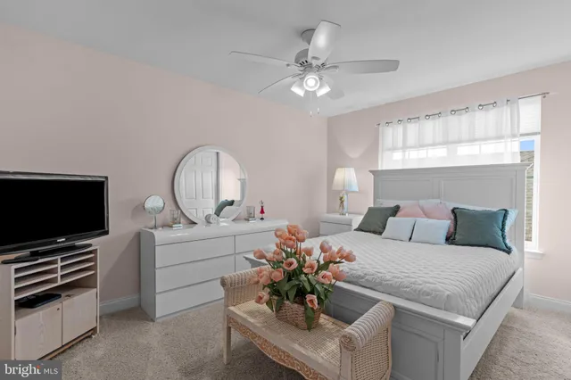 a bathroom with a sink a toilet a mirror and shower curtain