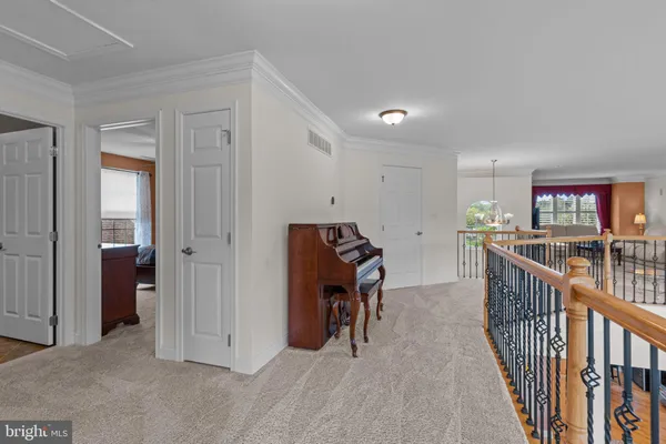 a view of a hallway with stairs