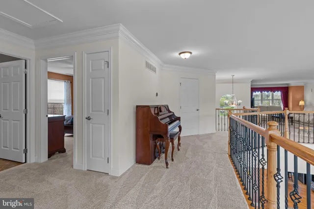 a view of a hallway with stairs