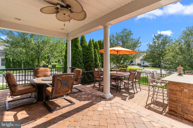a patio with a patio table and chairs