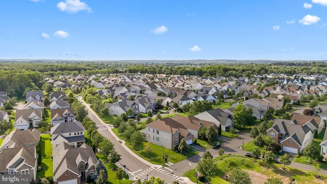 an aerial view of a house with a garden