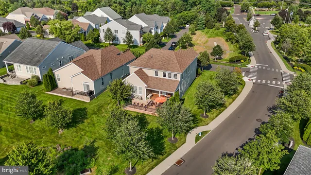 an aerial view of residential house with outdoor space and swimming pool