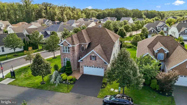 an aerial view of house with yard