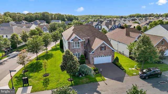 an aerial view of a house with a garden