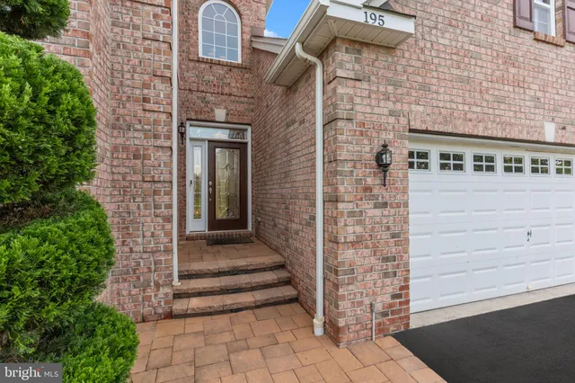 a view of a brick house with a large windows