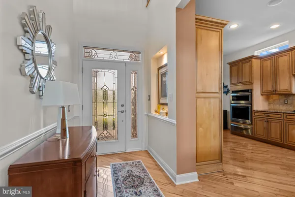 a kitchen with stainless steel appliances granite countertop a sink and cabinets