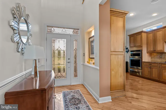 a kitchen with stainless steel appliances granite countertop a sink and cabinets