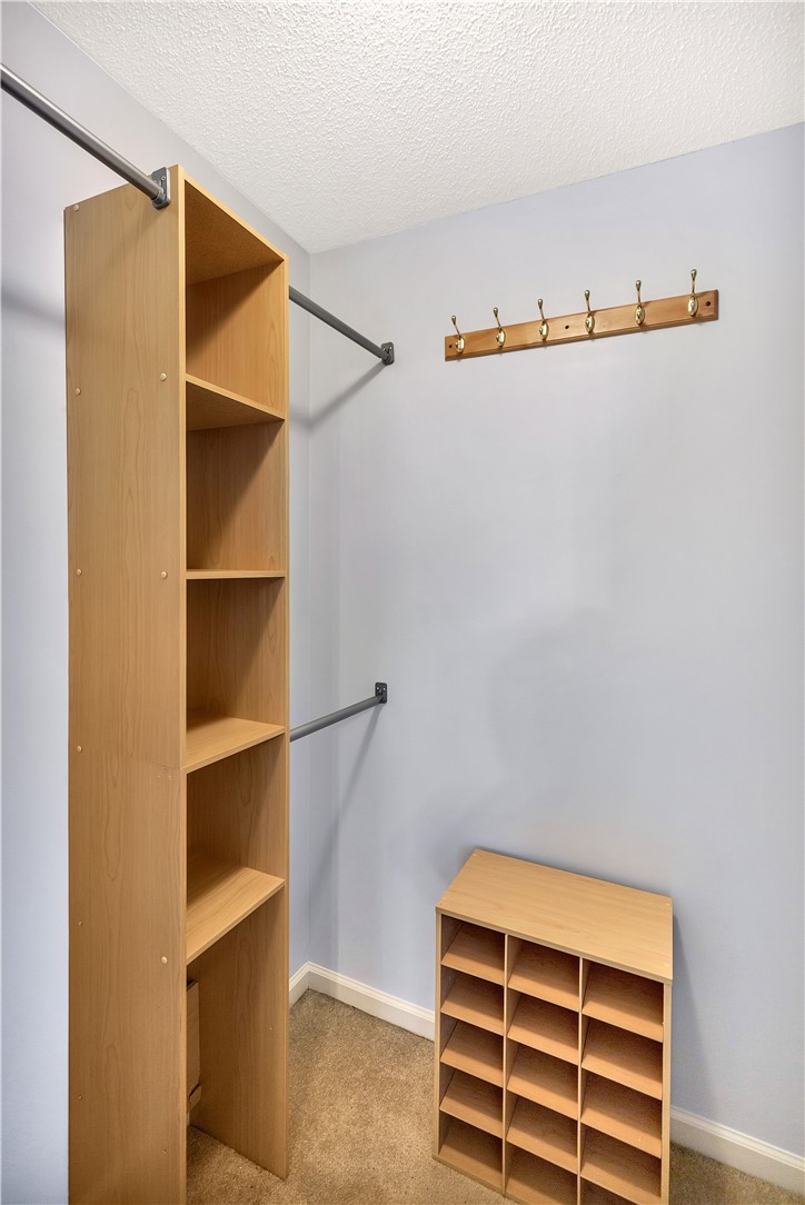256 Rock Creek Road Clemson, SC 29631 - Photo 17 of 30 This organized primary closet offers convenient storage solutions with ample shelving and hanging space.