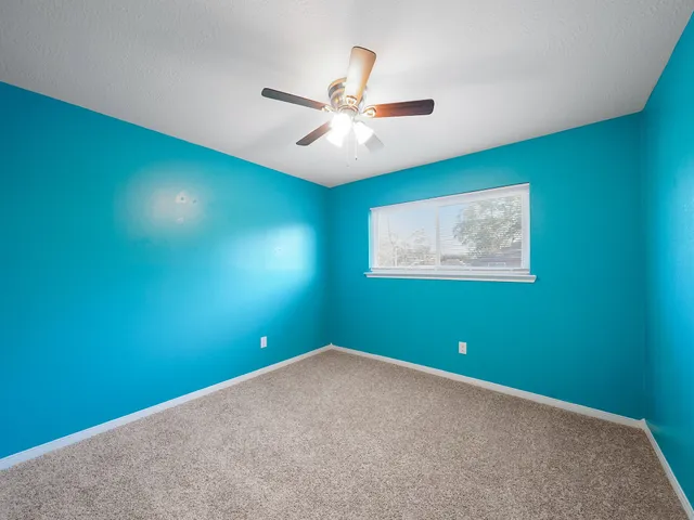 an empty room with fan