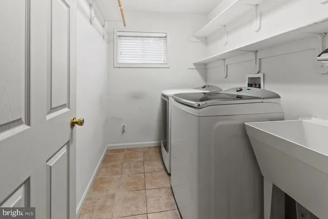 a bathroom with a sink a toilet and a tub