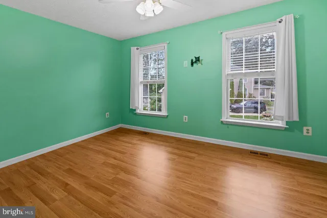 a view of a room with window wooden floor and windows