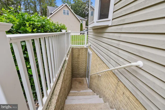a bathroom with a toilet sink vanity and mirror