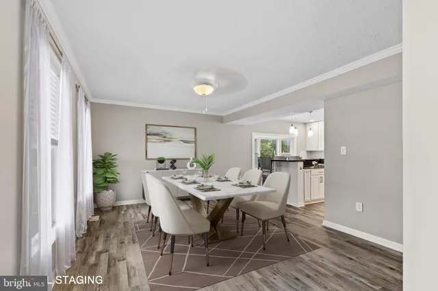 a view of a dining room with furniture and wooden floor
