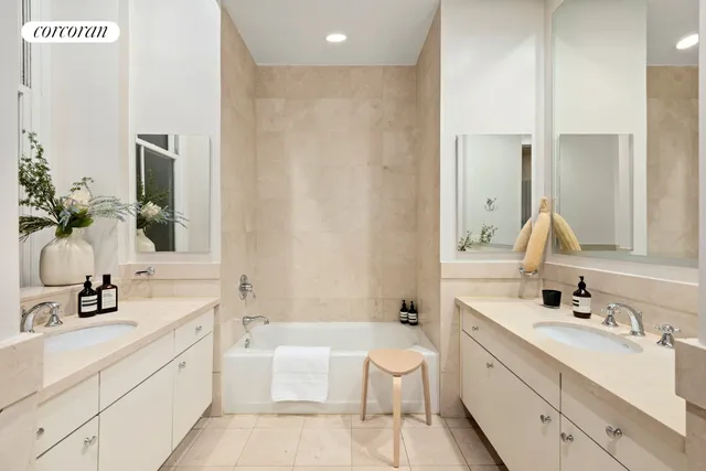 a bedroom with a bed and lamp