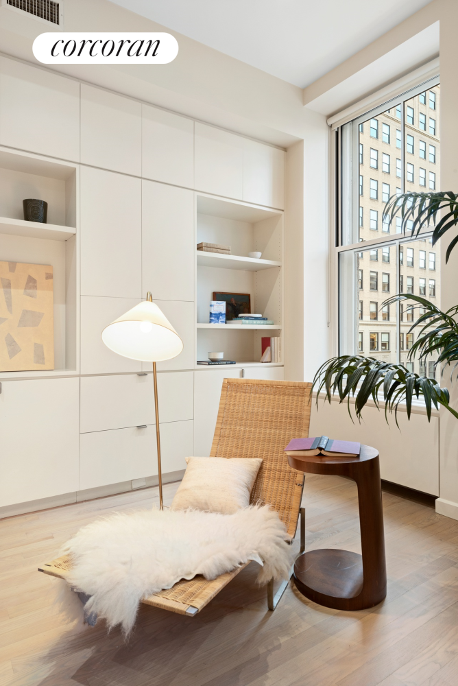 73 Worth Street, Unit 3A Manhattan, NY 10013 - Photo 9 of 18 a room with a bed and a table