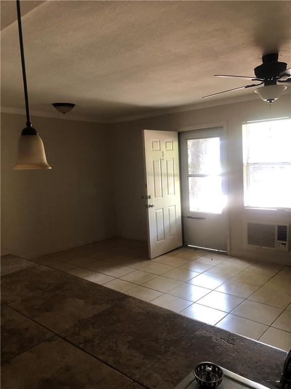 7007 Guadalupe Street, Unit 1 Austin, TX 78752 - Photo 3 of 8 an empty room with windows