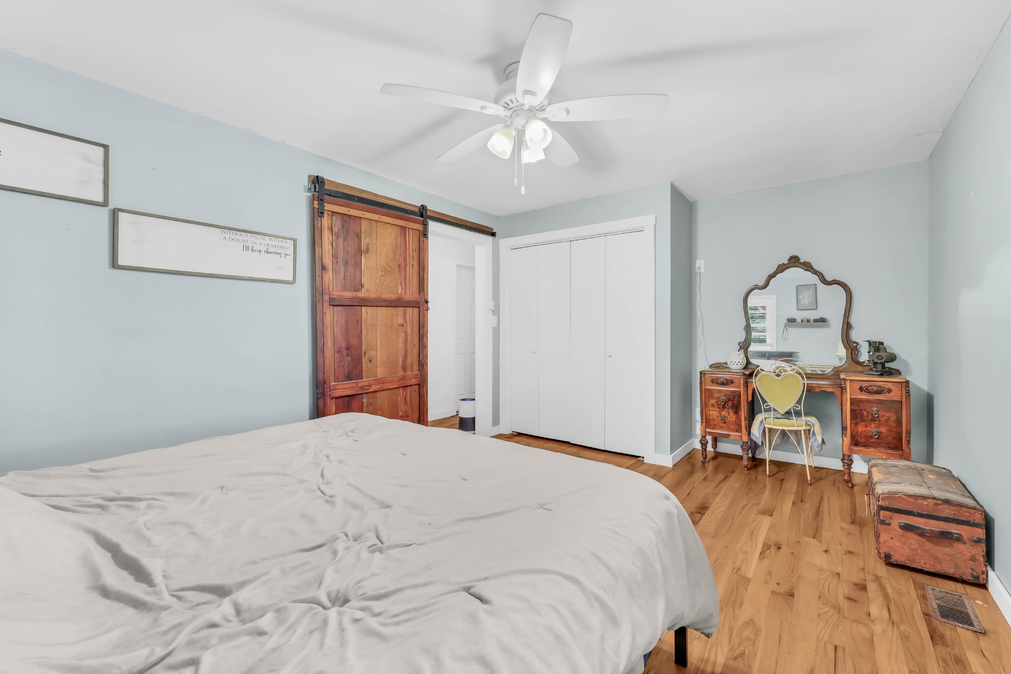 1068 Hugh Hunter Road Oak Grove, KY 42262 - Photo 21 of 30 a bedroom with a bed and a chandelier