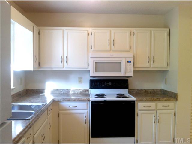 5763 Forest Lawn Court Raleigh, NC 27612 - Photo 2 of 9 Brand new counters, brand new cabinet hardware, and freshly painted cabinets!