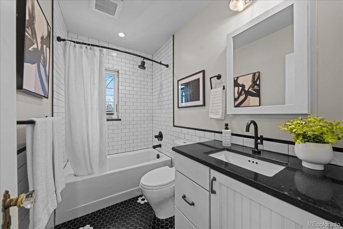 1378 Forest Street Denver, CO 80220 - Photo 20 of 50 a bathroom with a granite countertop sink toilet and shower