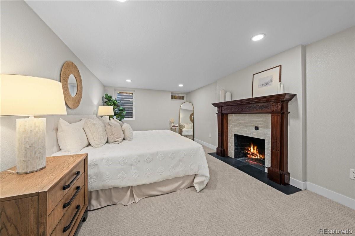 1378 Forest Street Denver, CO 80220 - Photo 32 of 50 a bed room with a bed and a night stand