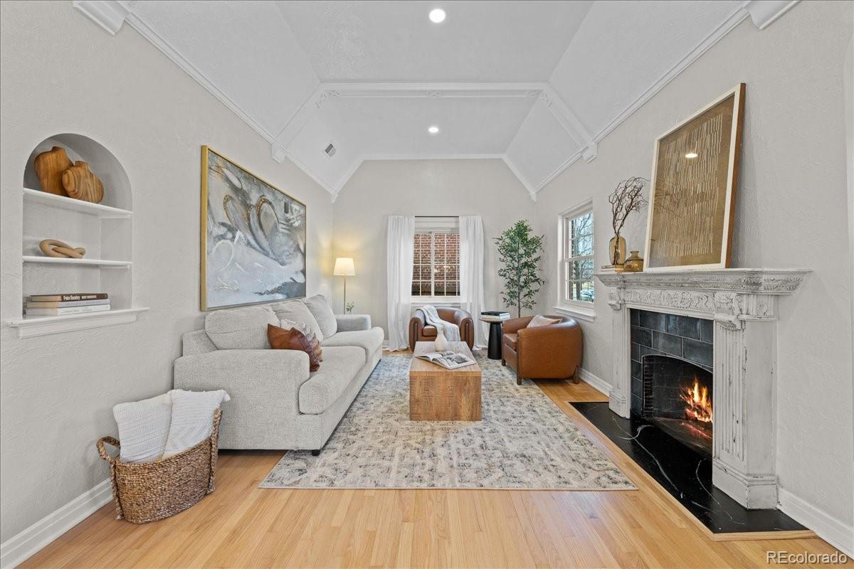 1378 Forest Street Denver, CO 80220 - Photo 4 of 50 a living room with furniture and a fireplace