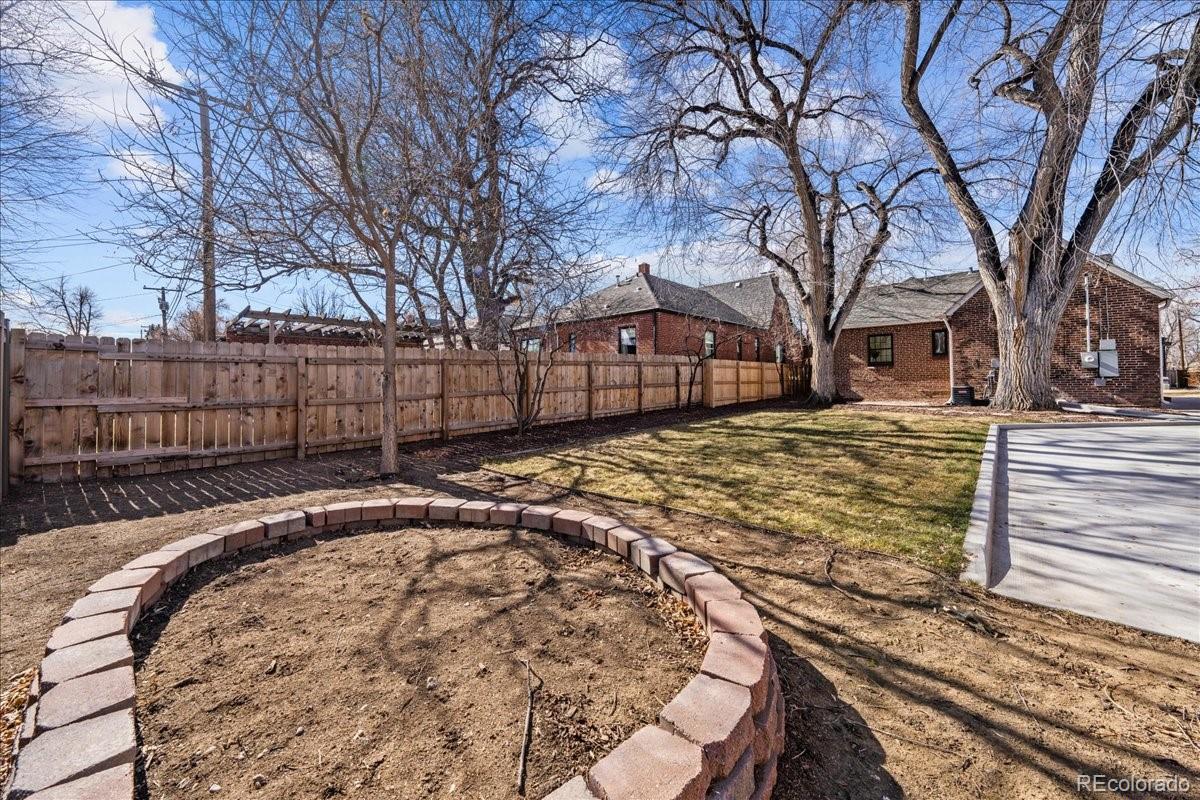 1378 Forest Street Denver, CO 80220 - Photo 42 of 50 a view of a yard with a large tree