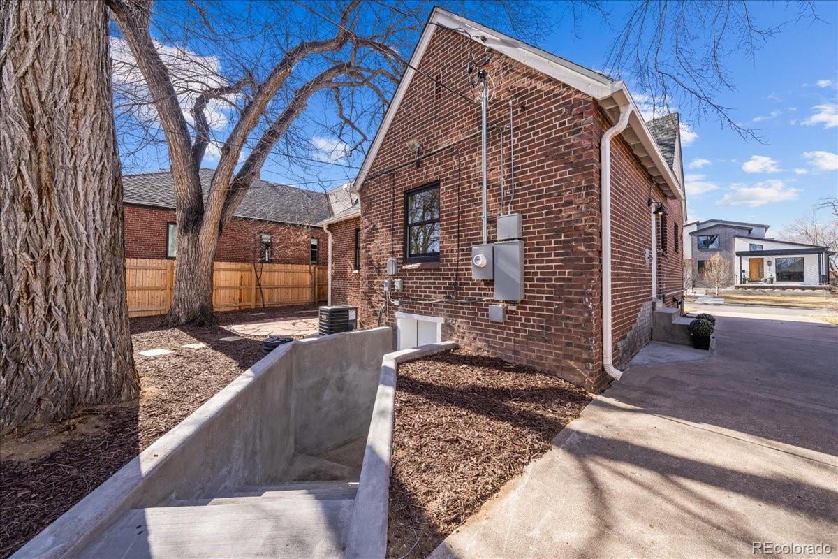 1378 Forest Street Denver, CO 80220 - Photo 45 of 50 a view of a house with a yard