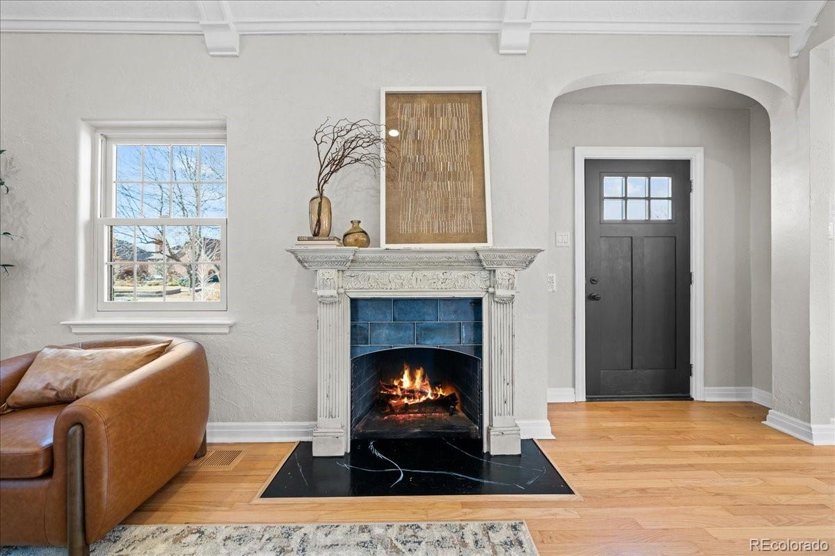 1378 Forest Street Denver, CO 80220 - Photo 7 of 50 a living room with furniture and a fireplace