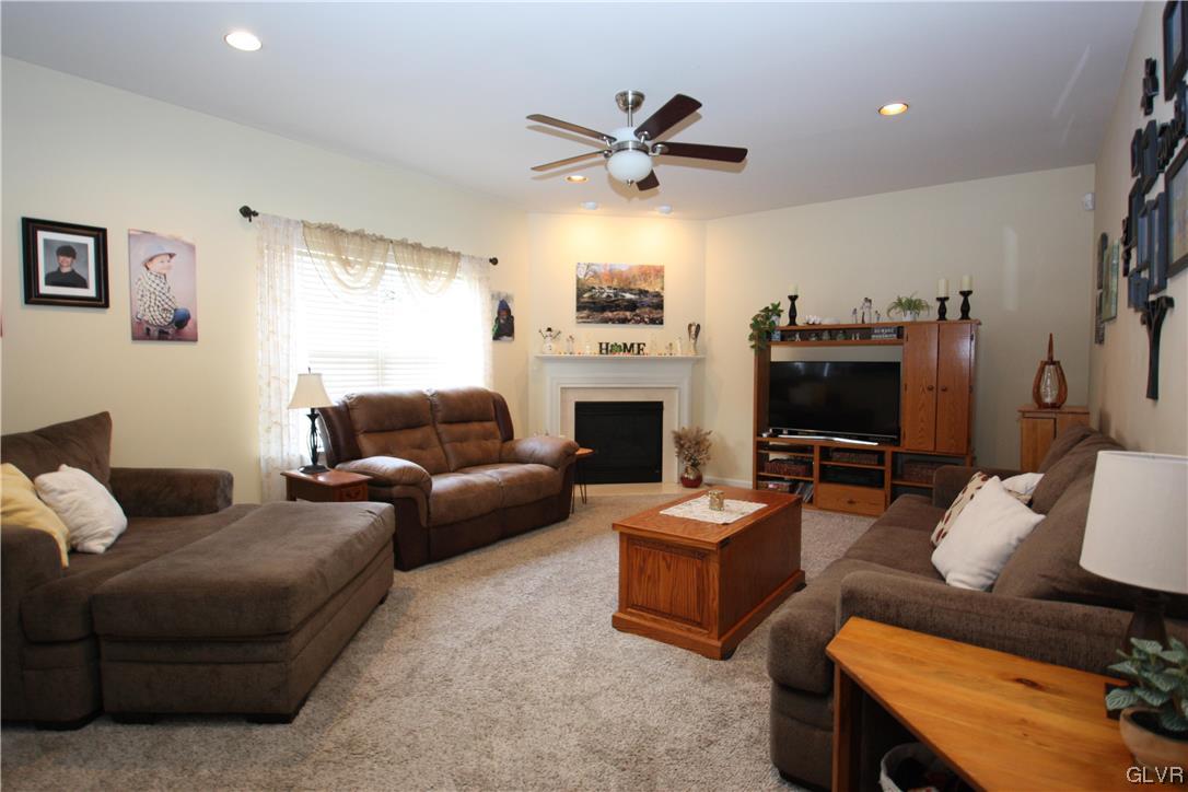 3838 Rittenhouse Road Lower Macungie Township, PA 18062 - Photo 4 of 26 a living room with furniture a flat screen tv and a window