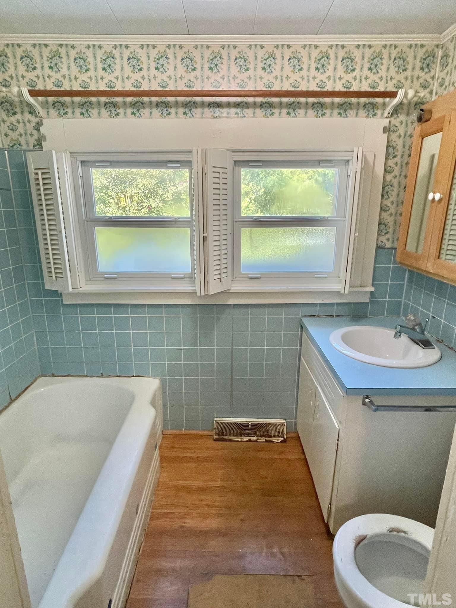 88 Cavel Chub Lake Road Roxboro, NC 27574 - Photo 15 of 20 a bathroom with a sink a toilet and a bathtub
