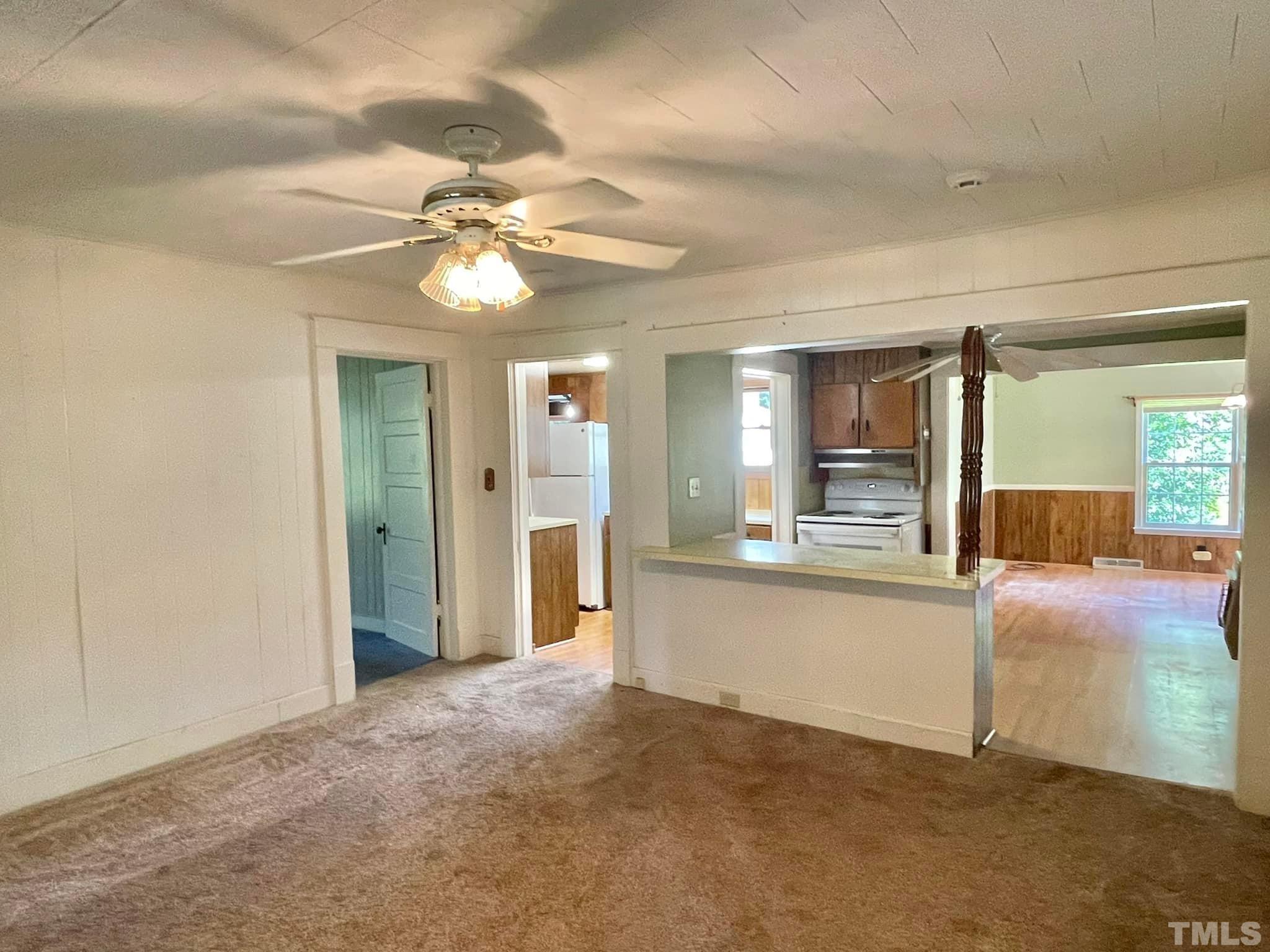 88 Cavel Chub Lake Road Roxboro, NC 27574 - Photo 10 of 20 a view of a kitchen with a sink and a chandelier fan