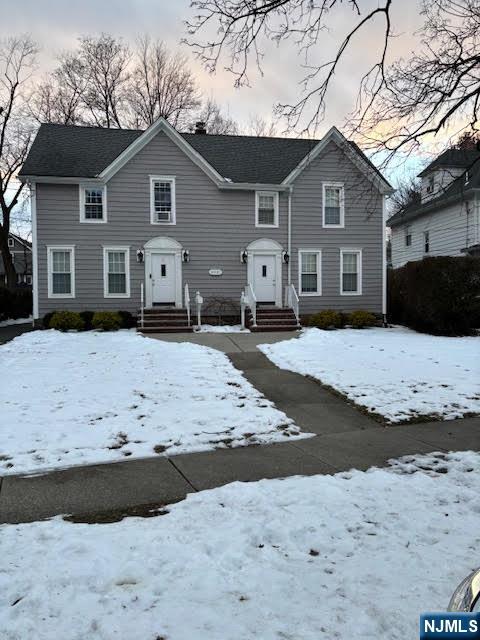 333 Maple Avenue Oradell, NJ 07649 - Photo 1 of 16 a front view of a house with a yard covered with snow
