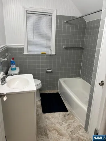 a bathroom with a sink a bathtub and a shower