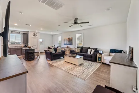 a kitchen with stainless steel appliances stove microwave refrigerator and cabinets