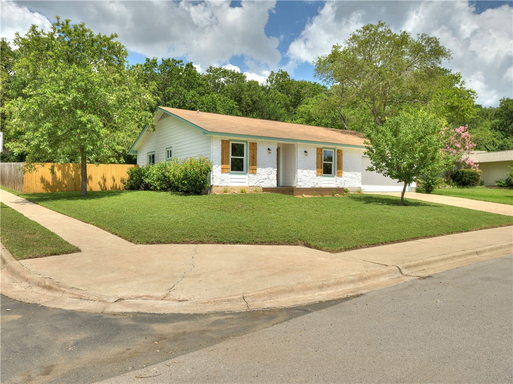 12208 Scribe Drive Austin, TX 78759 - Photo 1 of 1 a view of a house with a yard and a garden