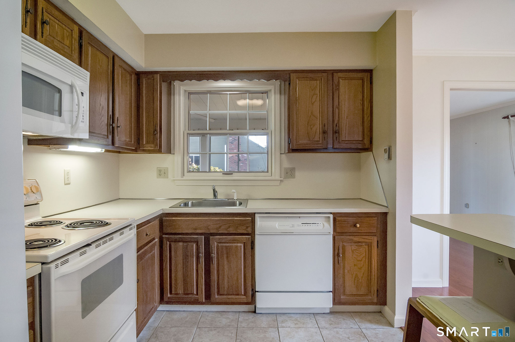 1 Downing Way, Unit 1 Madison, CT 06443 - Photo 12 of 26 a kitchen with a sink stove and cabinets